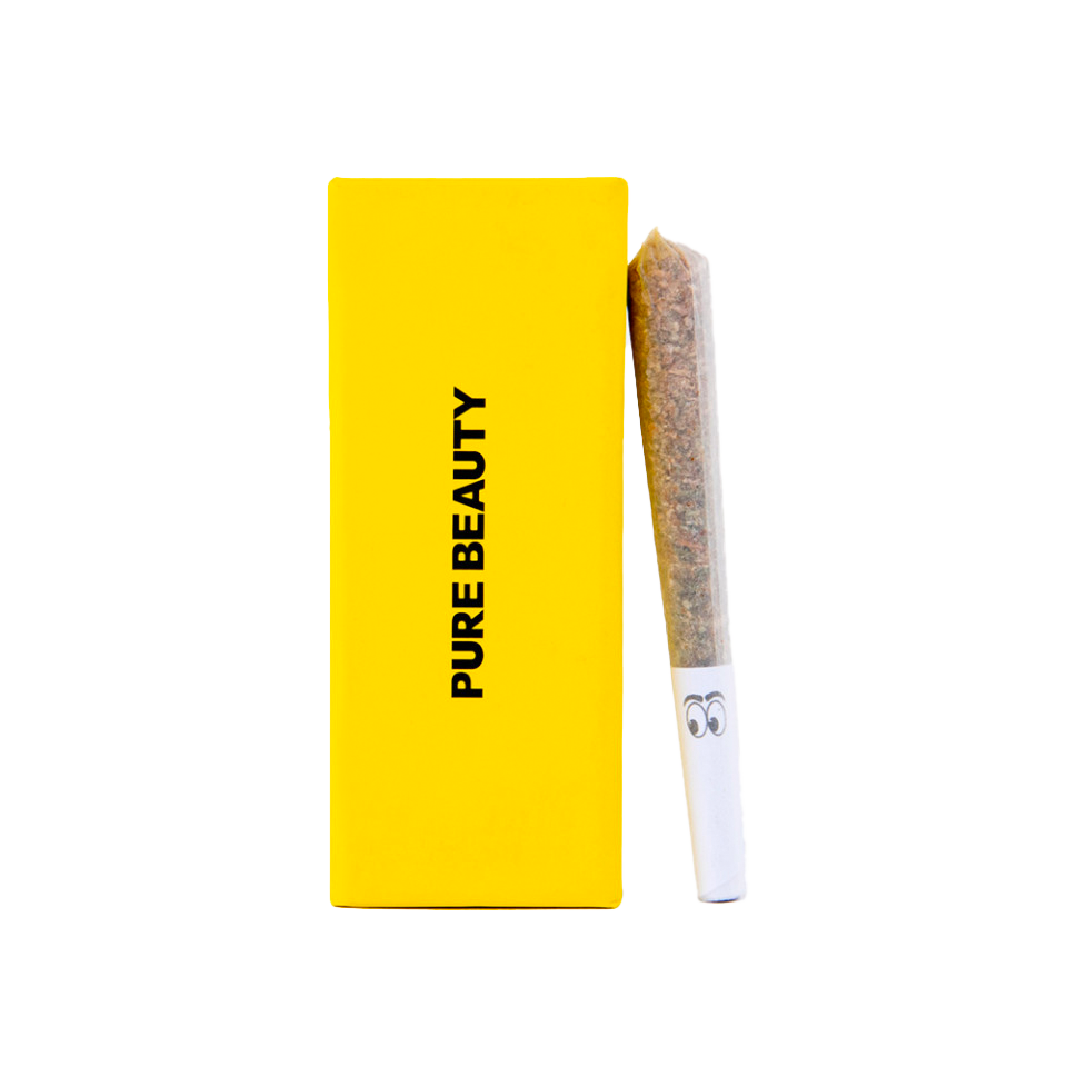 joint leans against yellow pure beauty box